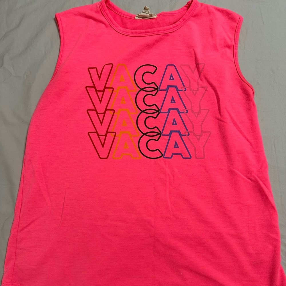 Neon pink tank with word Vacay on the front